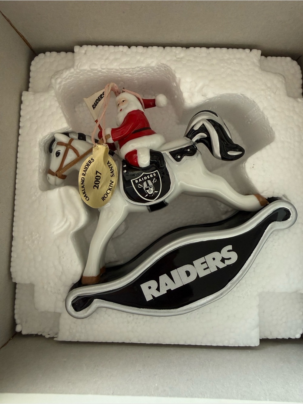 Danbury Mint Black and White Raiders Rocking Horse Santa Ornament 2007